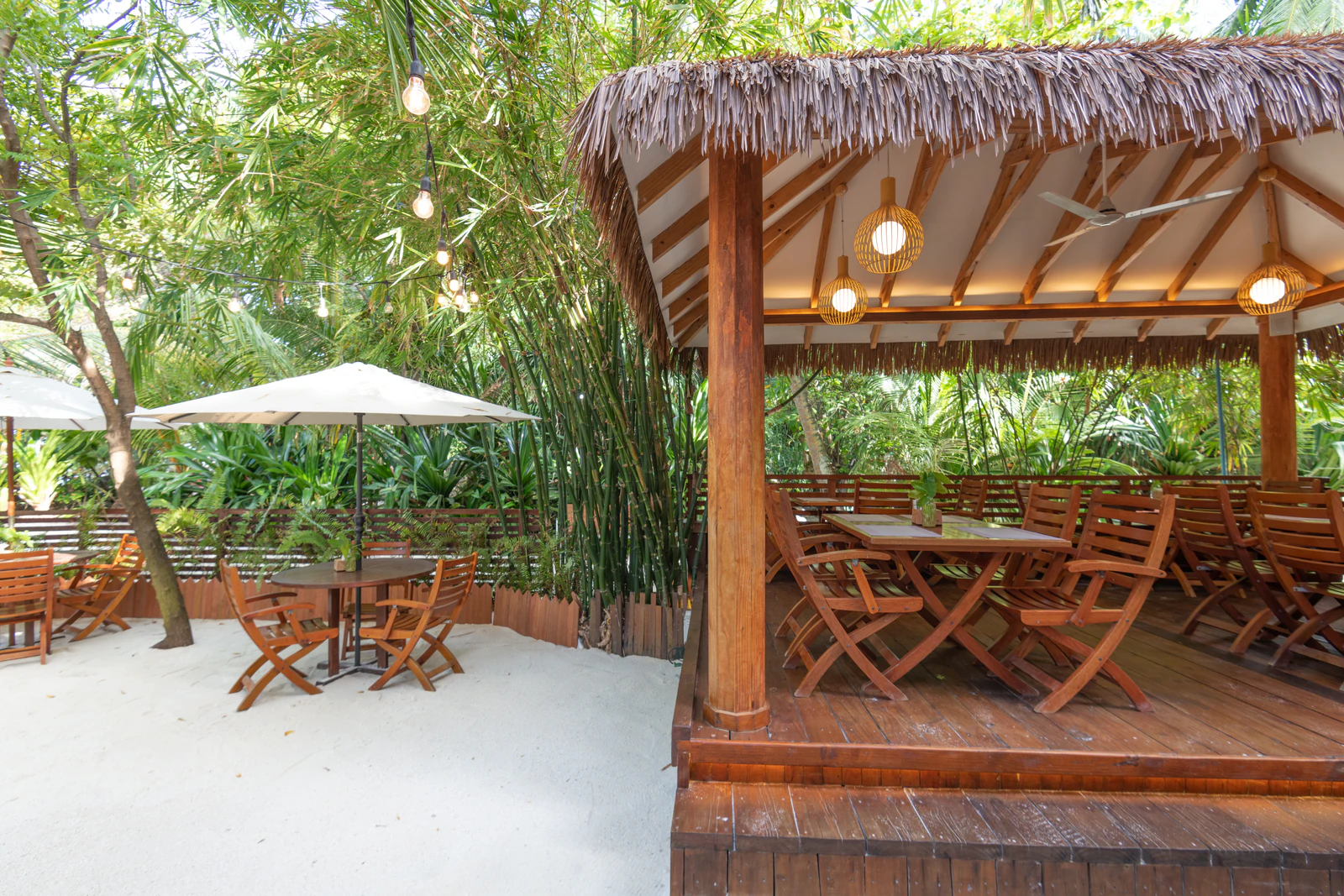 The thatched restaurant gazebo and garden courtyard at Ostrov Beach