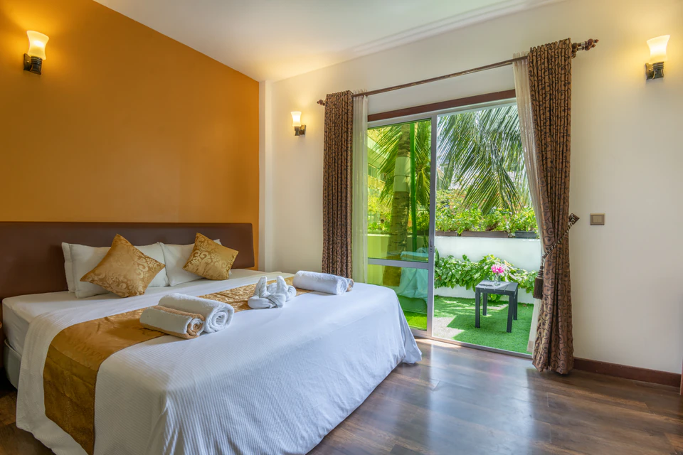 Alternate view of the double bed and garden patio doors