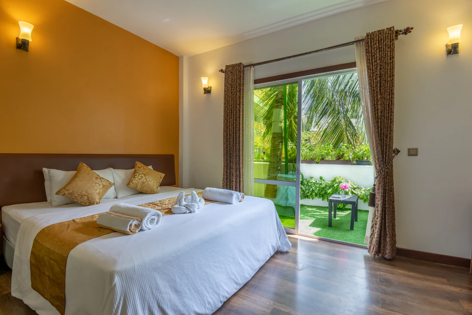 Third view of the double bed and small garden patio