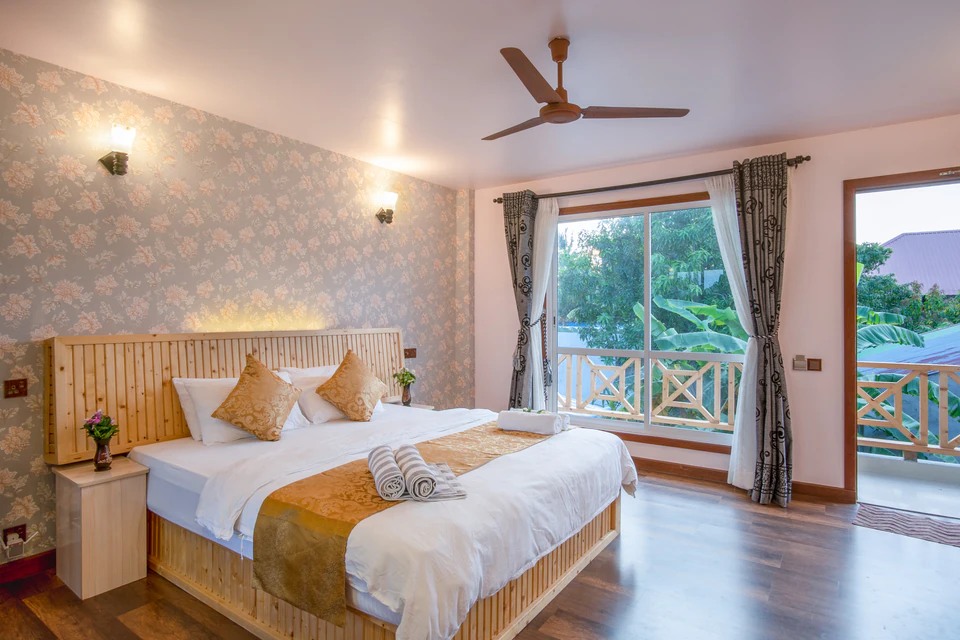 Alternate view of the double bed and balcony doors