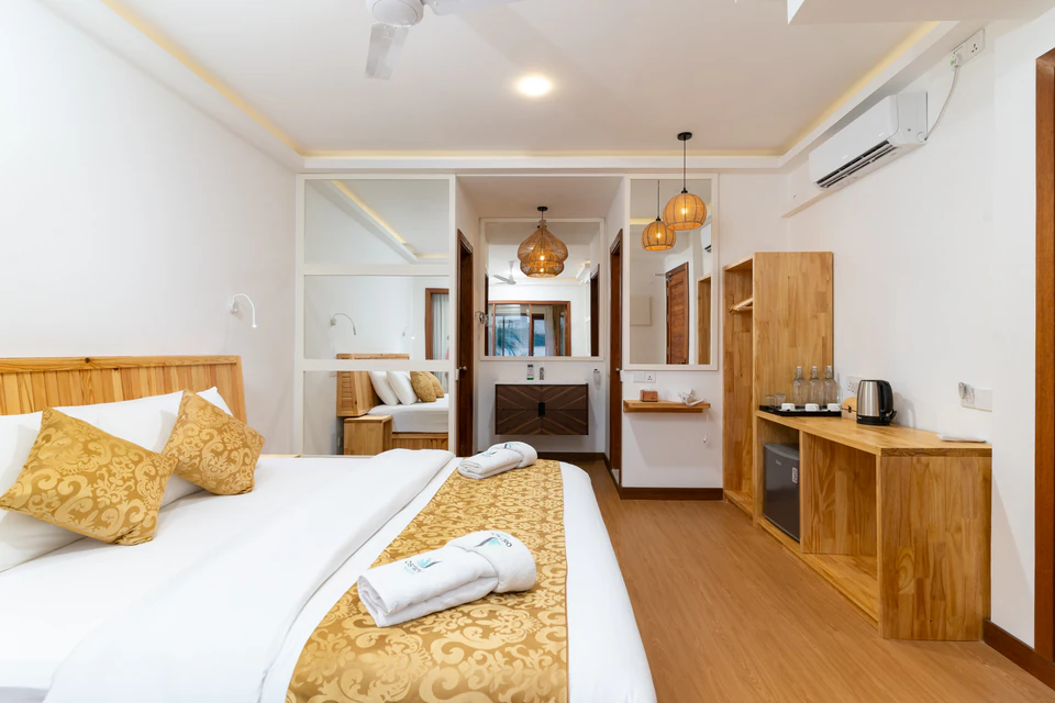 Wide view showing beds and the connecting passage between rooms