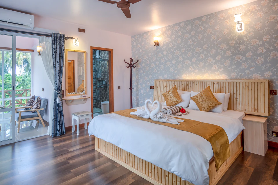 Angled view of the double bed and balcony area