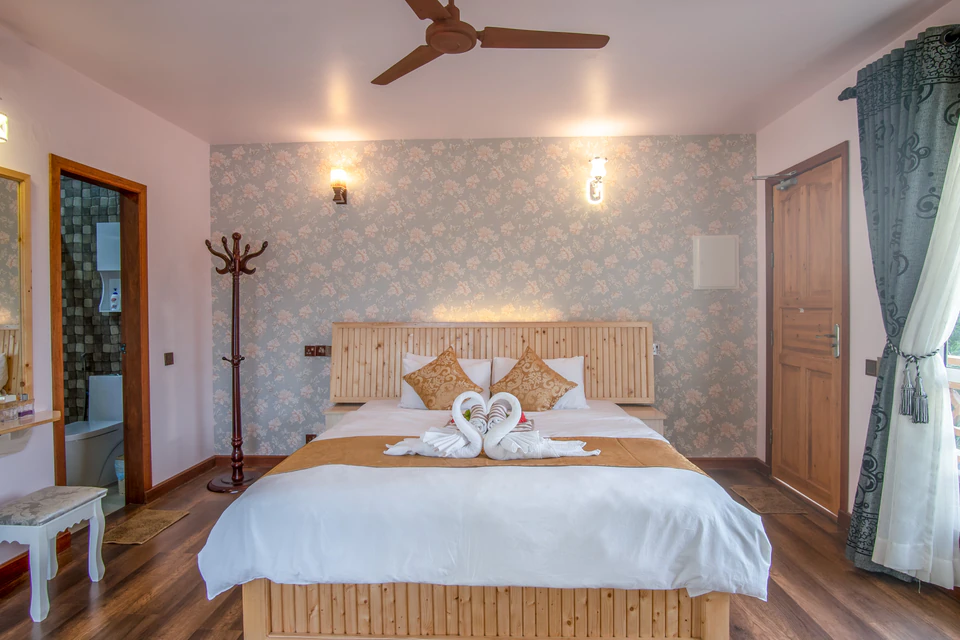 Front room view with towel swans arranged on the double bed