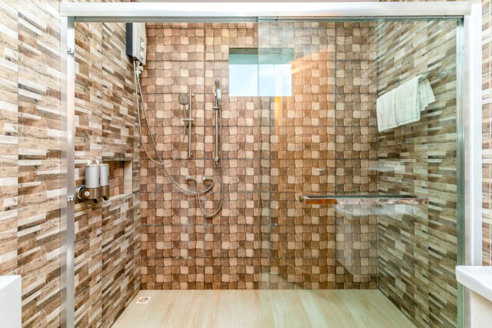 Interior view of the tiled walk-in shower