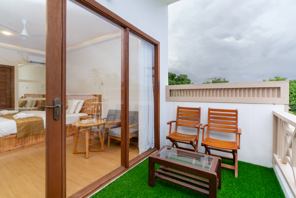 Private balcony with two chairs and a small table